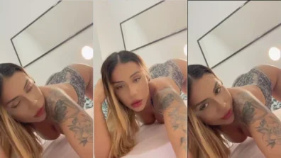 Bela Marquez on all fours in bed provoking